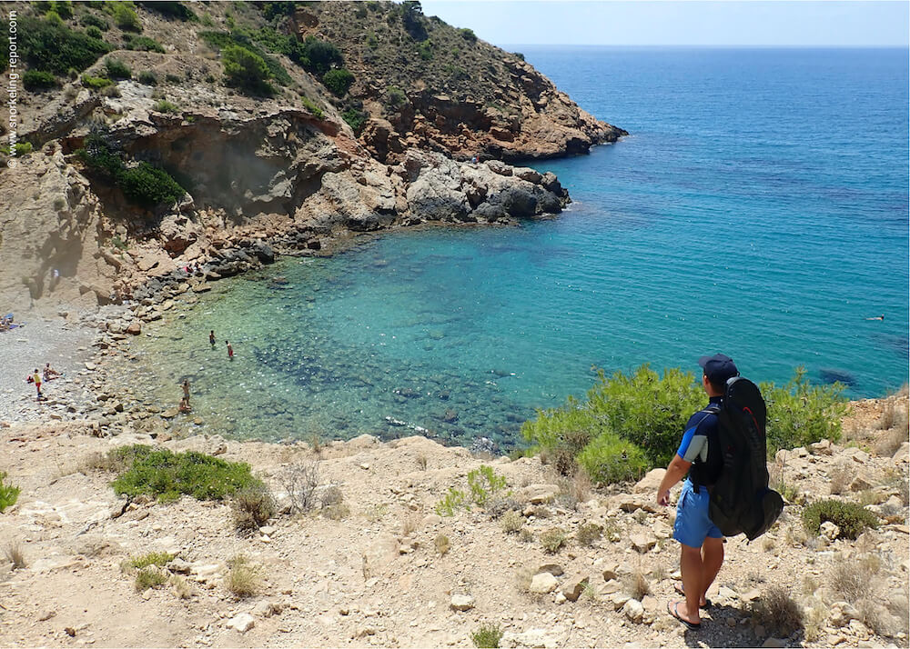 Snorkeler overlooking a rocky bay